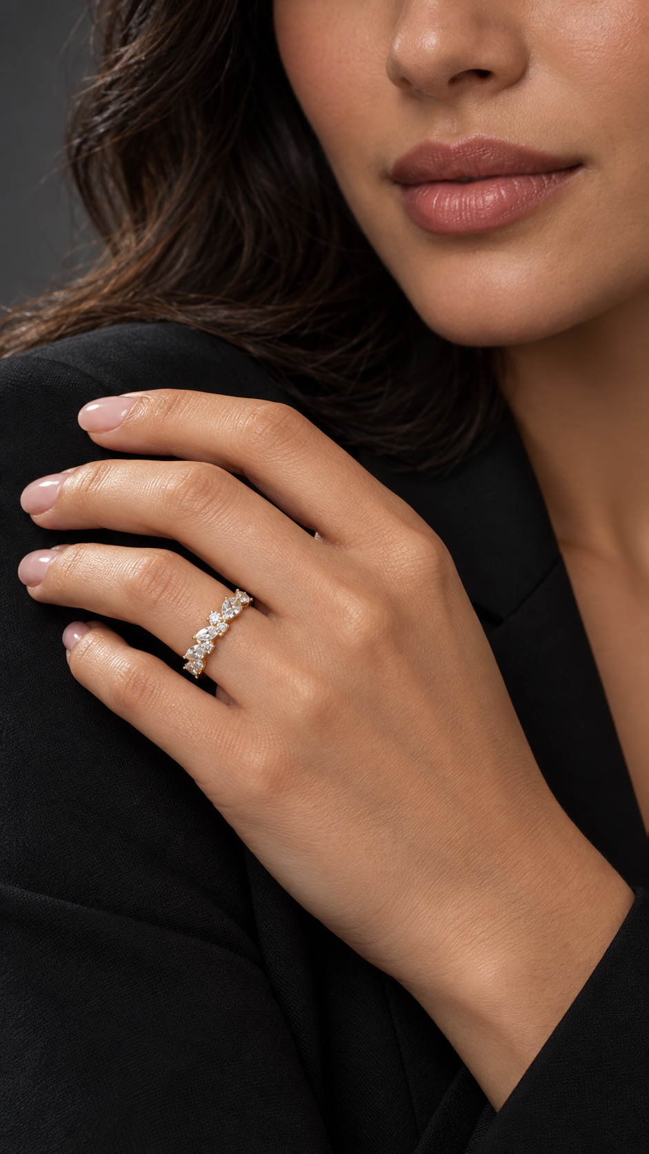 Model wearing 14K yellow gold multi-shape diamond band with a staggered arrangement of stones.
