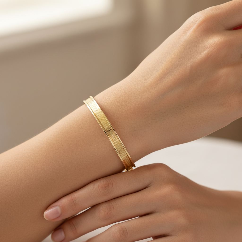 Classic Greek Key design bangle crafted in 14K yellow gold