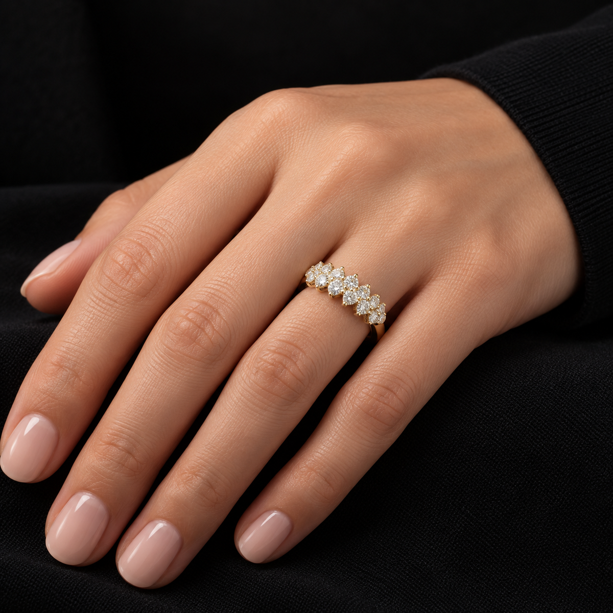 Model wearing a 14k yellow gold multi-stone diamond band