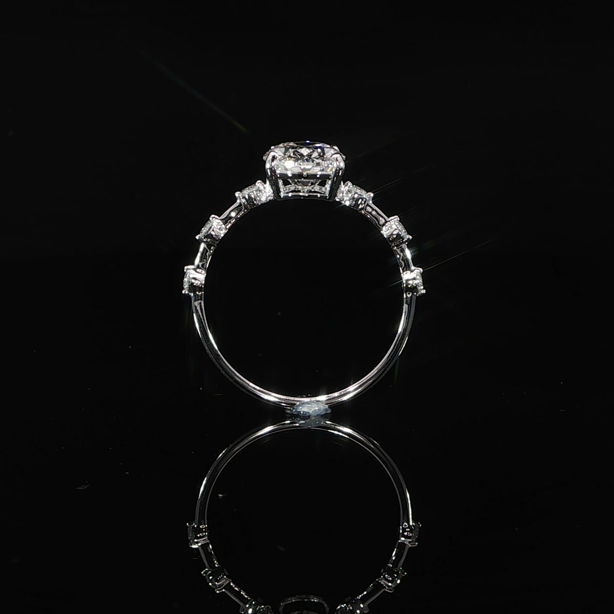 Modern 2-carat oval diamond engagement ring with a refined diamond station band in 14K gold.