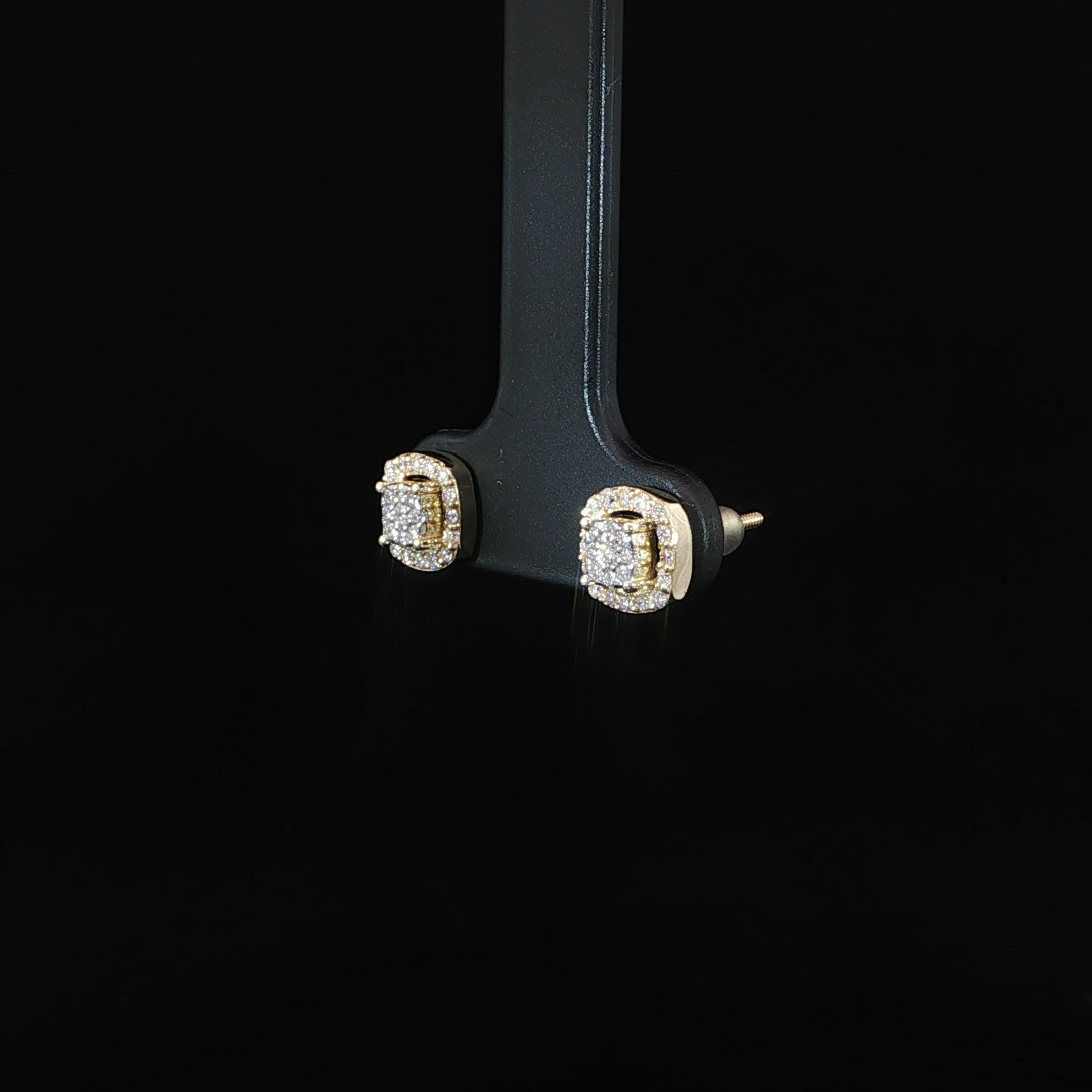 Natural diamond cushion cluster halo earrings featuring 0.26 CTW