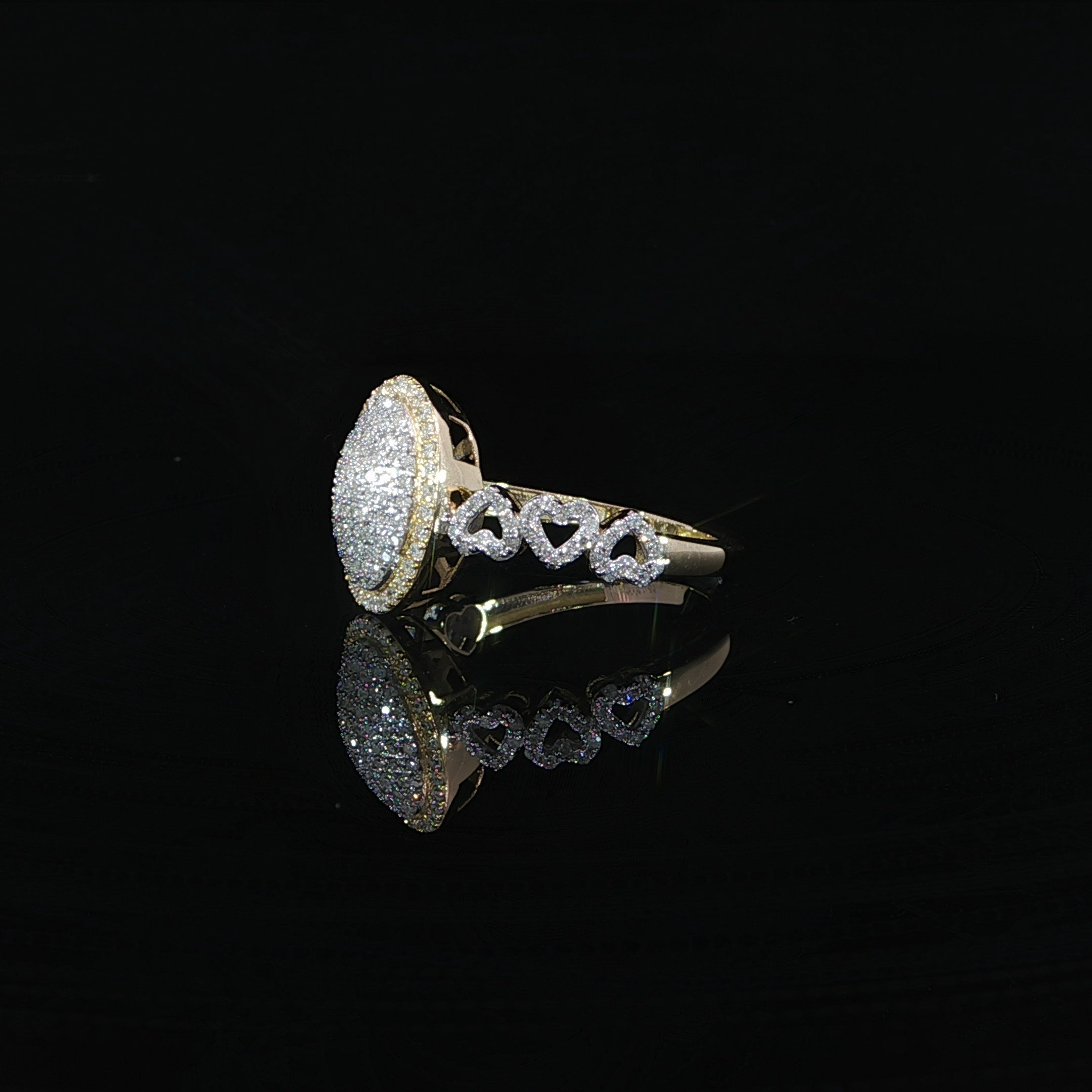 Oval natural diamond cluster ring featuring 0.51 CTW SI quality diamonds