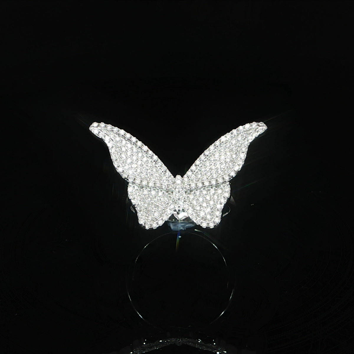 Top view of a sparkling open-winged butterfly ring covered with VVS moissanite.