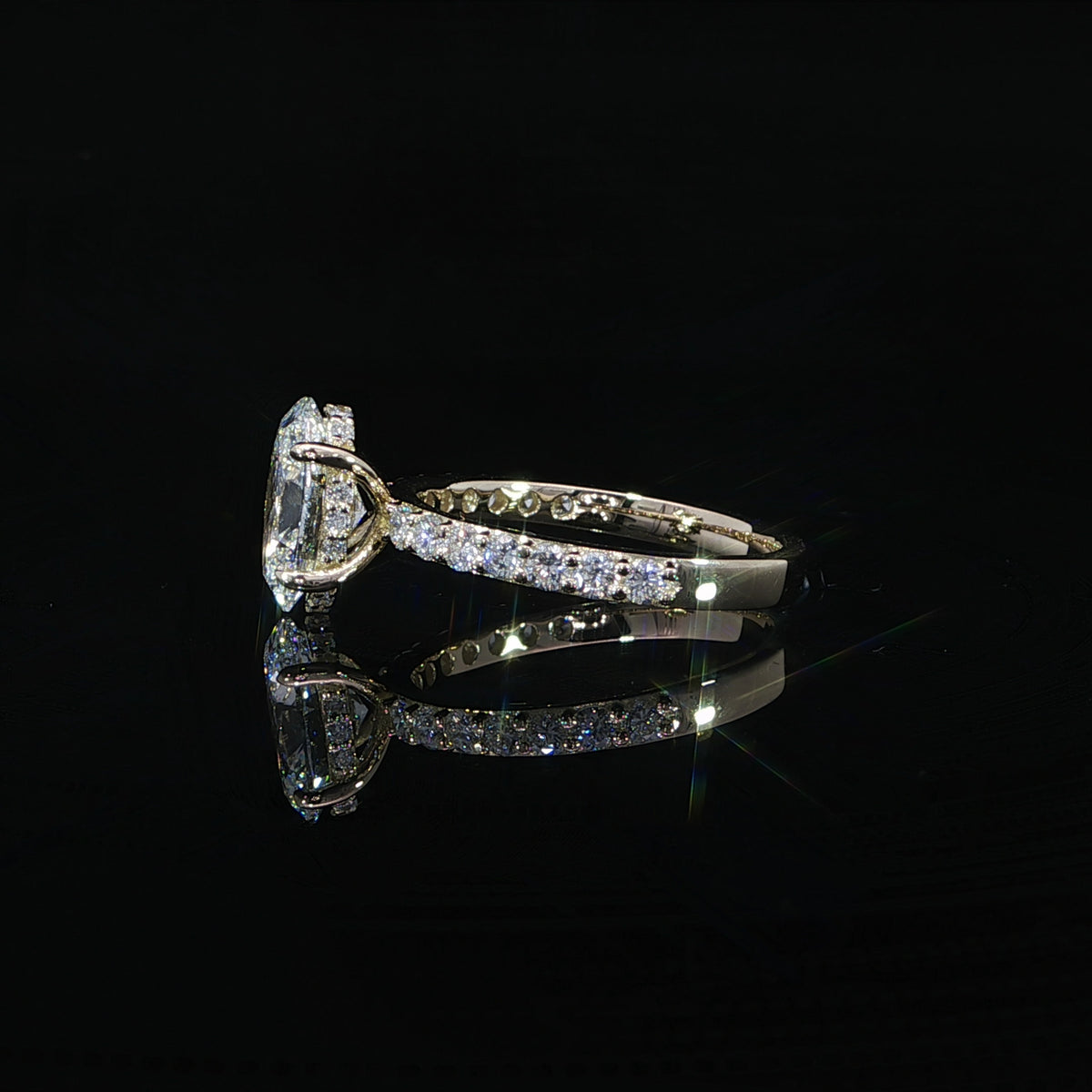 Side profile of an oval lab-grown diamond ring showing the hidden halo beneath the center stone.