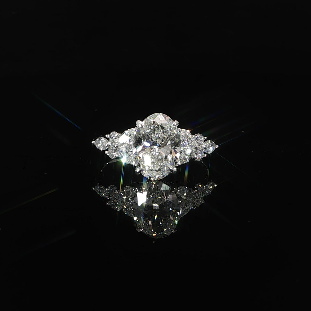 Close front view of a 2.52 CTW lab grown diamond engagement ring with a 2 carat oval center diamond.