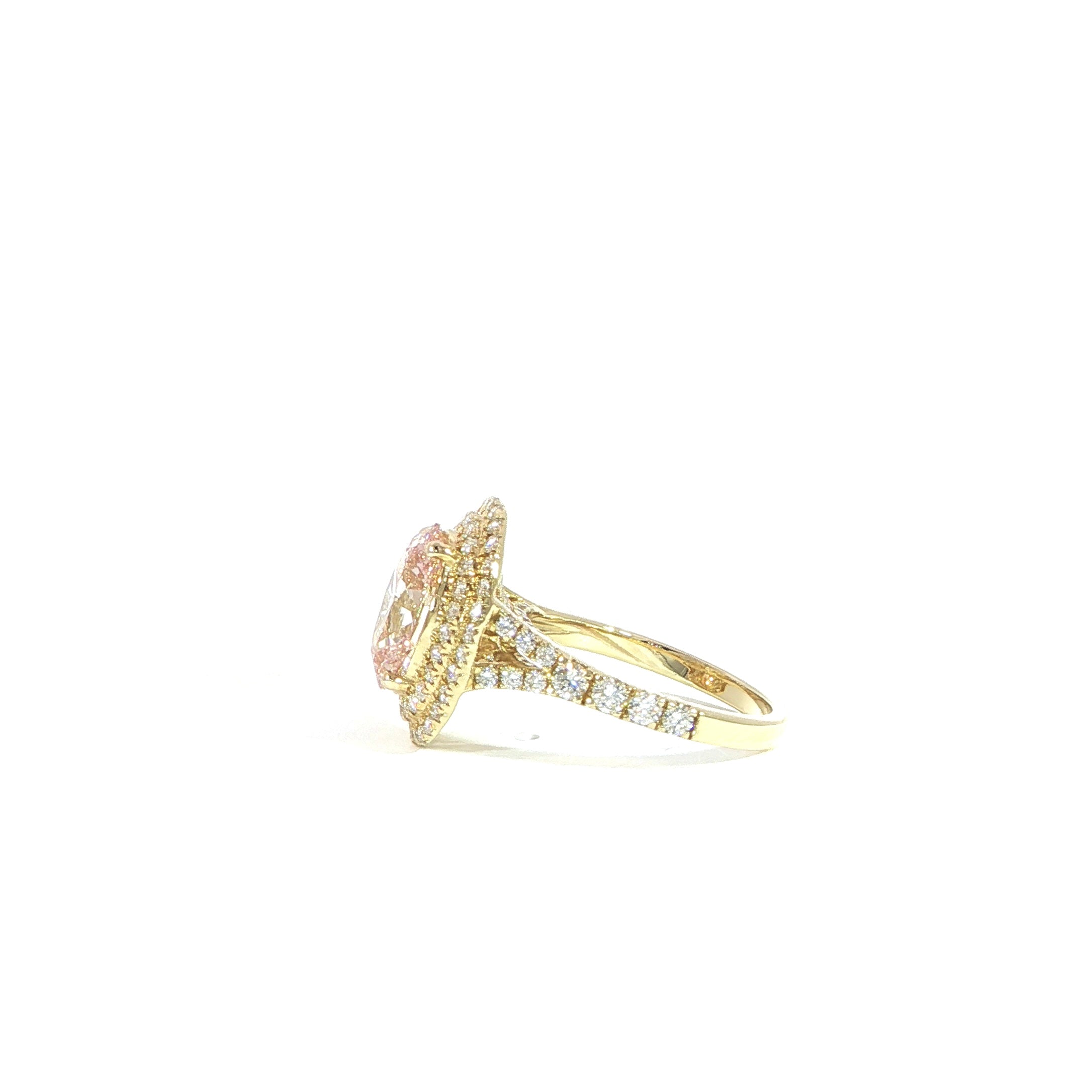 Fancy pink diamond ring with sparkling halo accents side