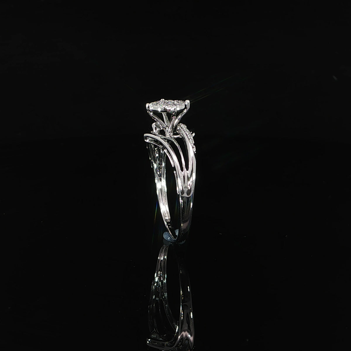 Upright profile of a 10K gold 0.07 CTW pavé composite engagement ring showing its curved band design.