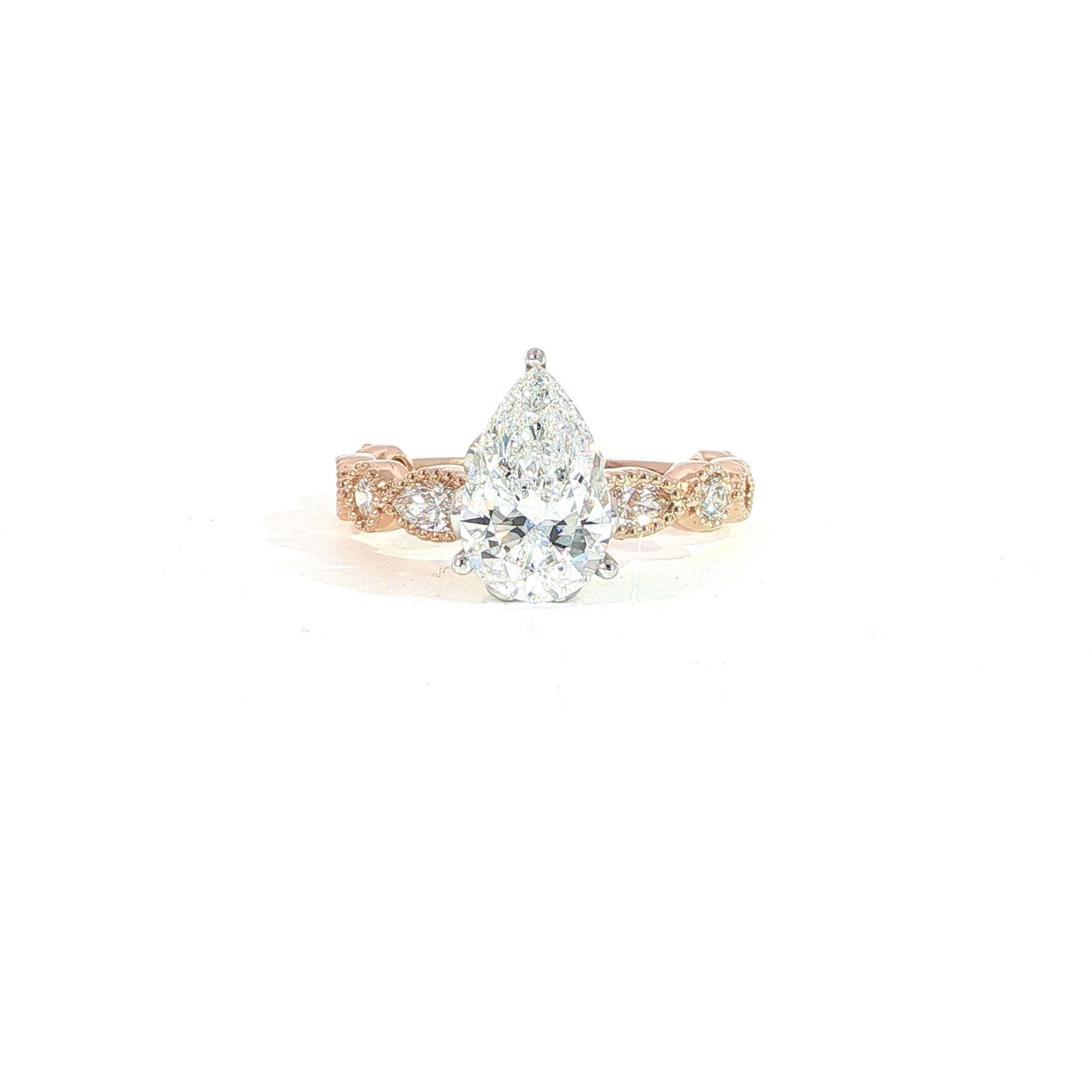 14K gold pear lab diamond engagement ring with vintage bezel-set diamond band and milgrain detail