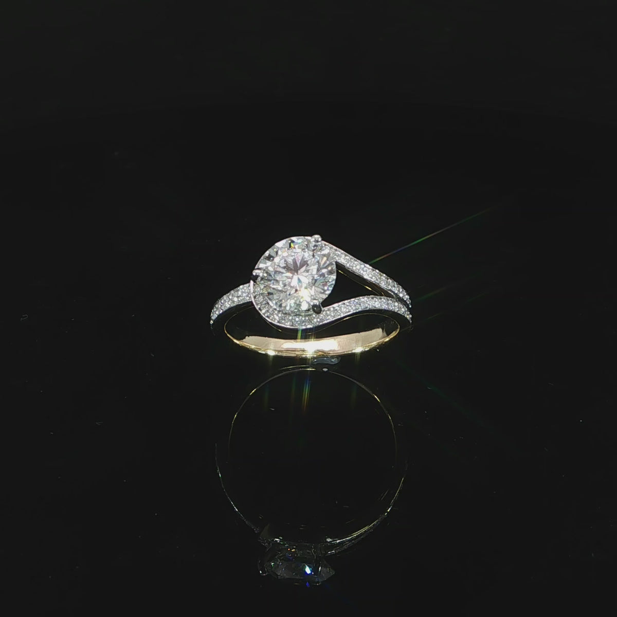 Angled video 14K yellow gold engagement ring featuring a 1.51 carat D color VS1 round lab grown diamond.