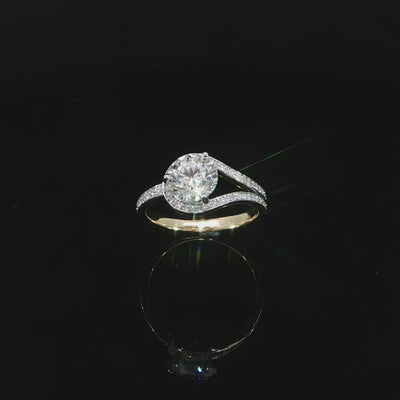 Angled video 14K yellow gold engagement ring featuring a 1.51 carat D color VS1 round lab grown diamond.