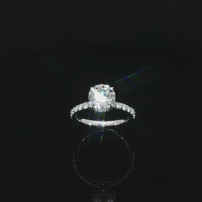 Angled video of a 14K white gold engagement ring with a 2.01-carat round center diamond.