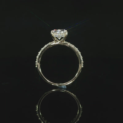 Video of the round diamonds set along the 14K yellow gold engagement ring band.