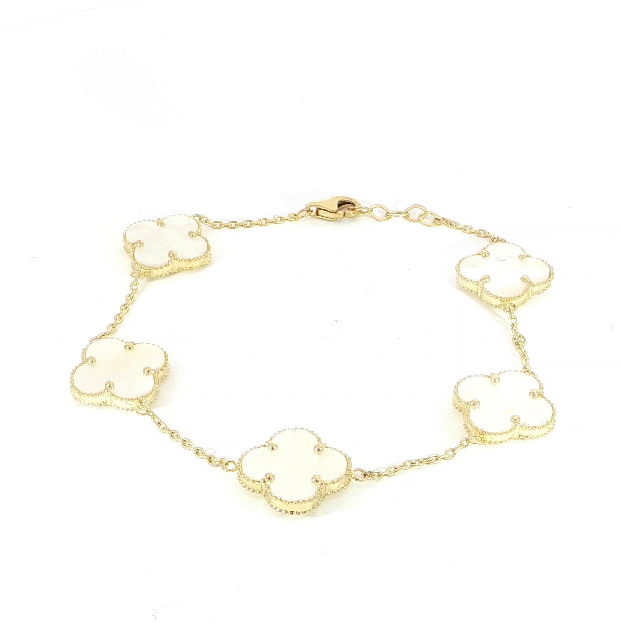 Video mother of pearl clover station bracelet in yellow gold