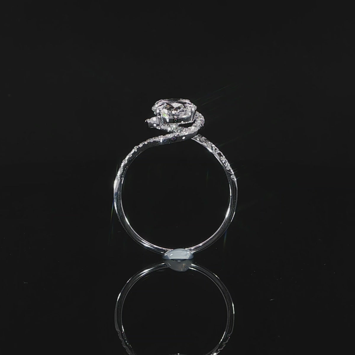 Detailed video of the diamond halo encasing the 2.03-carat oval center stone.