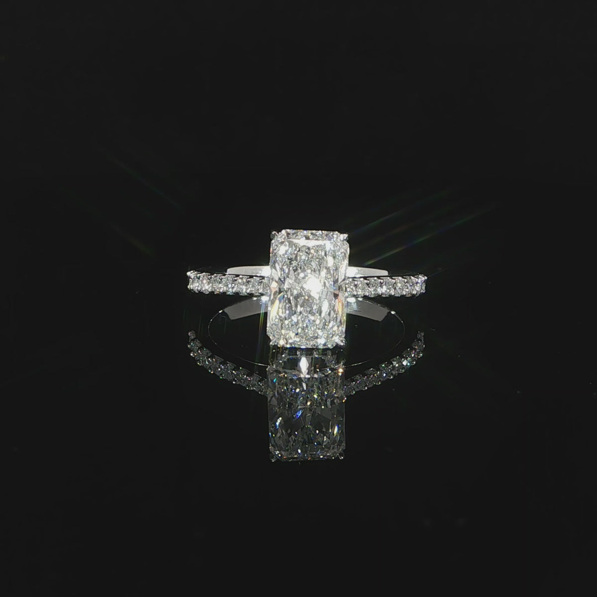 White gold radiant engagement ring featuring 2.53 carats total of lab-grown diamonds.