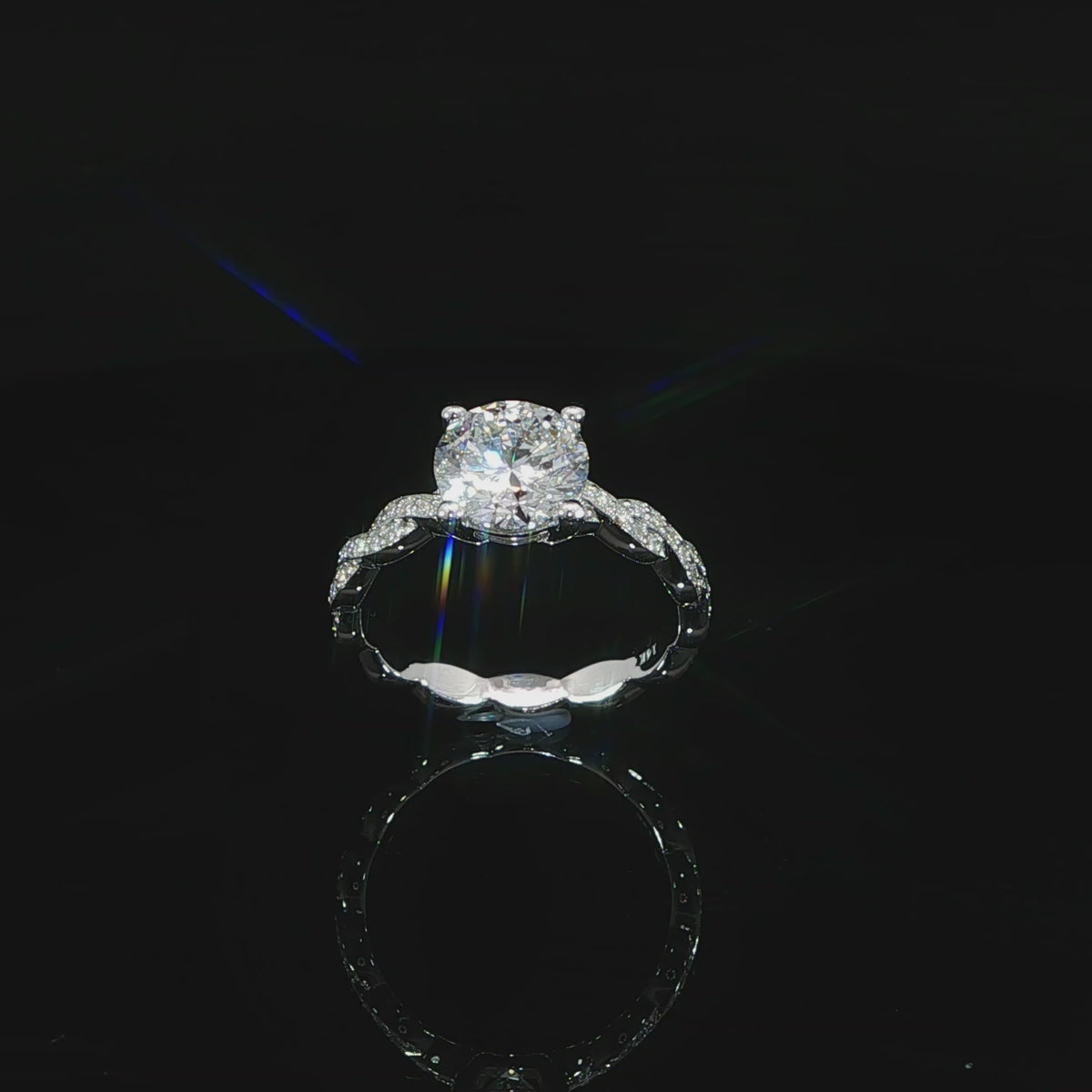 Angled video of round lab grown diamond ring with twist band