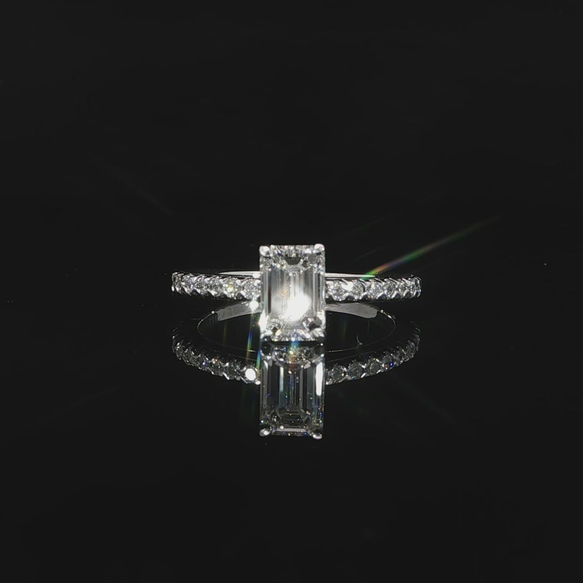 Horizontal video of 1.13-carat emerald-cut center and pave diamond shank.