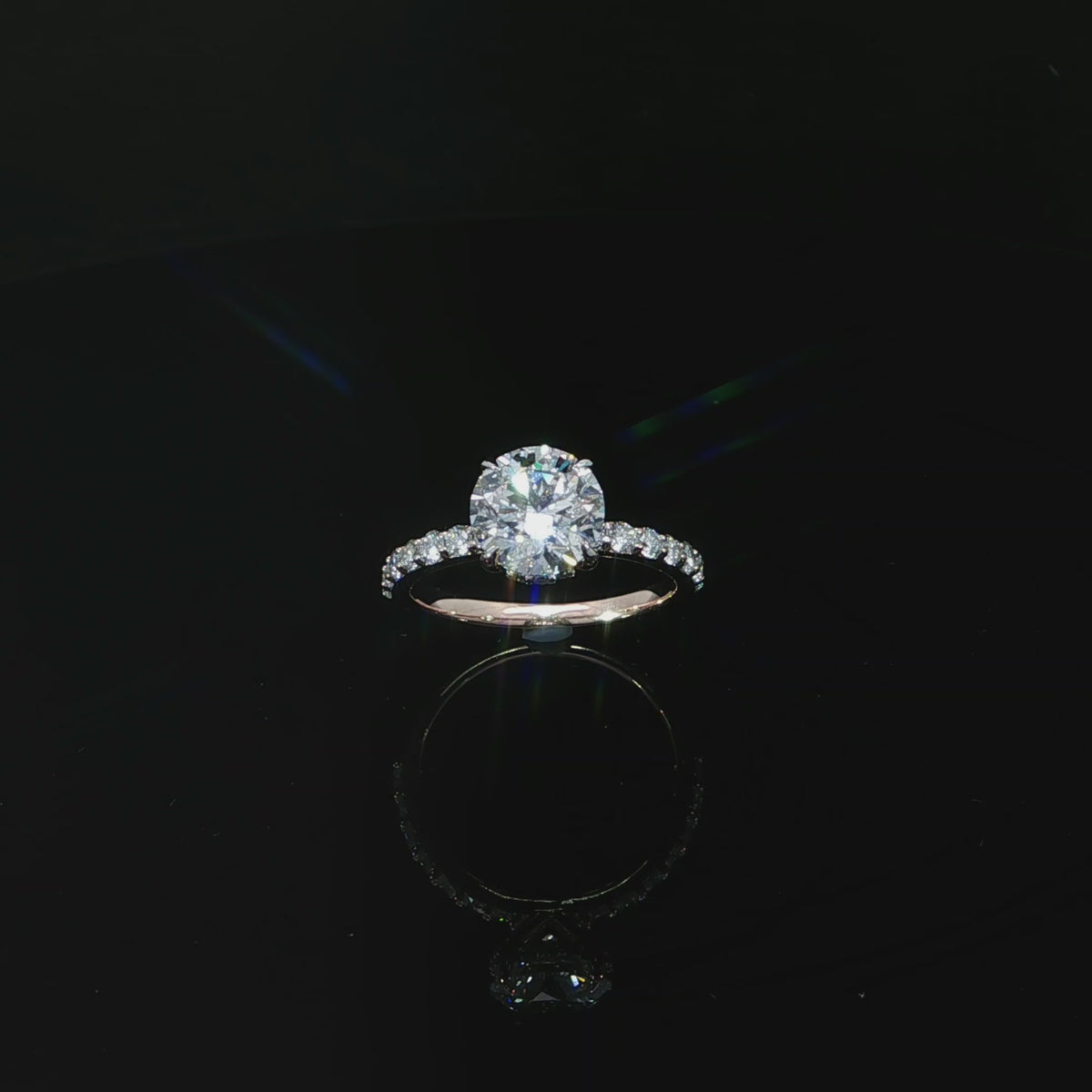 Rose gold ring featuring an E color, VS1 clarity round lab-grown center diamond with a hidden halo.