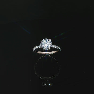 Rose gold ring featuring an E color, VS1 clarity round lab-grown center diamond with a hidden halo.