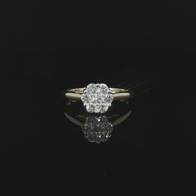 Video of a 10K yellow gold 0.50 CTW round cluster ring with one diamond surrounded by seven diamonds.