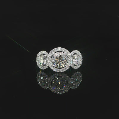 Video of a round three-stone diamond ring with individual halos in 14K white gold