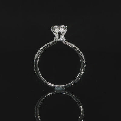 Video of the sides 2CT pear diamond ring showing the raised setting, hidden halo, and pavé diamond band.