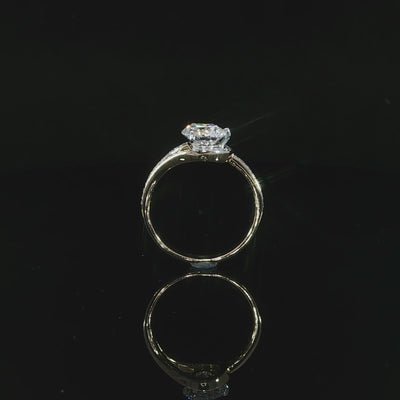 Video of a round brilliant diamond engagement ring with pavé-set bypass shoulders and a raised center setting.