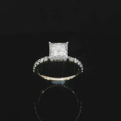 Video of a princess cut diamond ring showing the elevated setting and pavé diamond shoulders