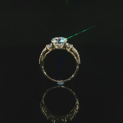14K gold round lab diamond ring with 2 CT center, side stones, and split shank design