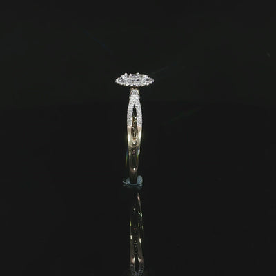 Upright profile of a 10K yellow gold 0.40 CTW diamond halo ring showing its open gallery.