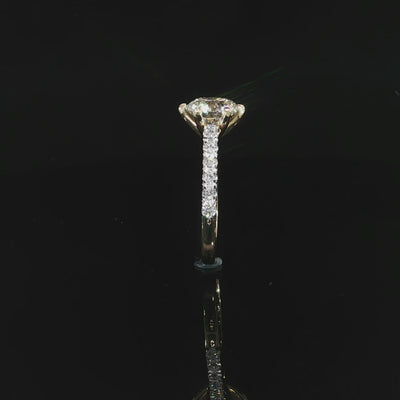 Detailed video of a round diamond engagement ring with a secure six-prong setting in yellow gold