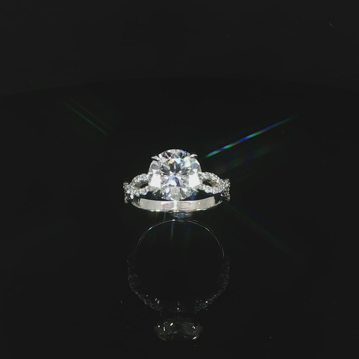 Video of a 14K white gold 3.37 CTW infinity diamond ring in an angled position.