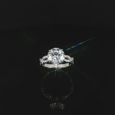 Video of a 14K white gold 3.37 CTW infinity diamond ring in an angled position.