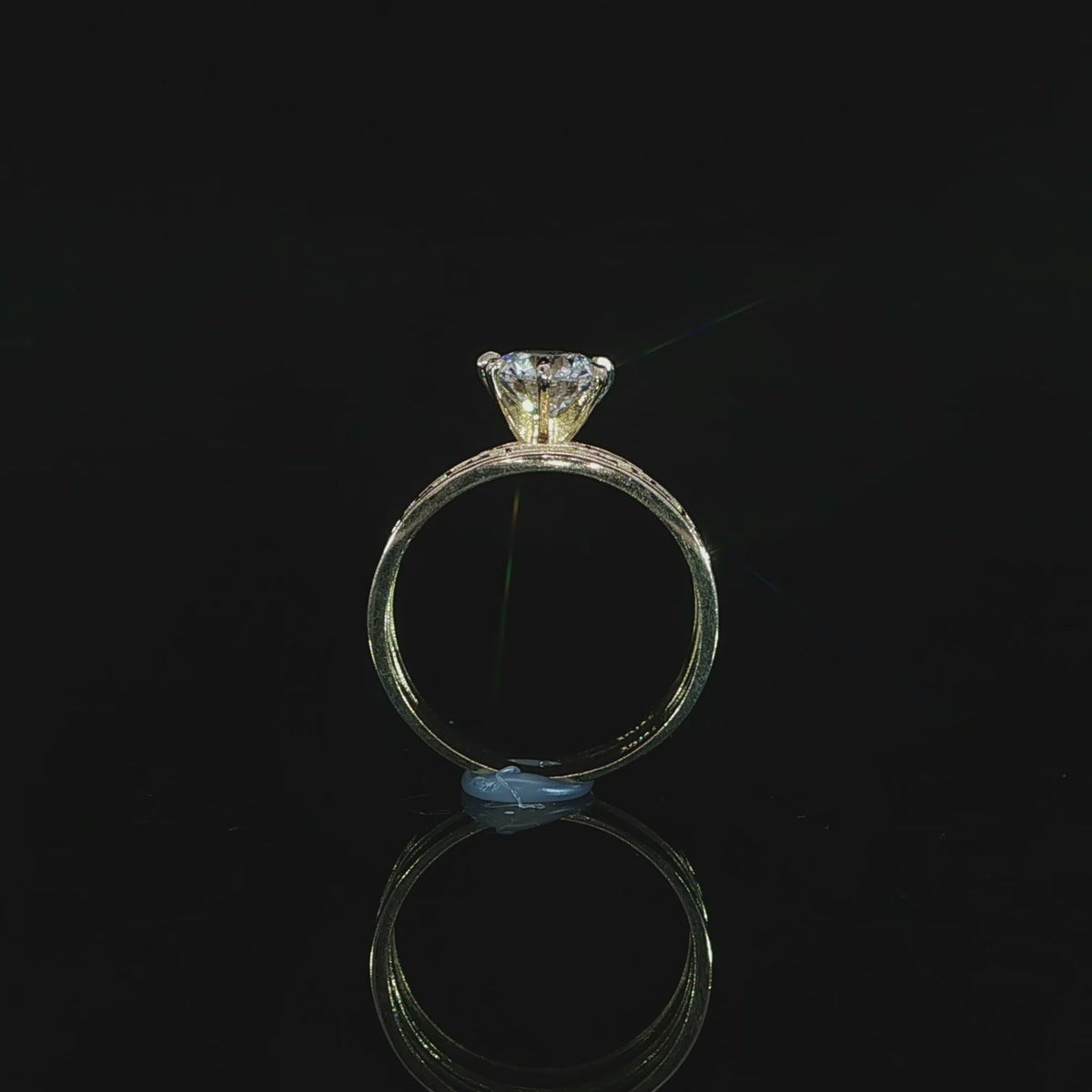 Upright profile of a 10K yellow gold Greek key ring set with a 1.21 CT lab-grown diamond in an open prong setting.