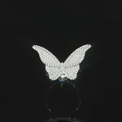 Statement butterfly cocktail ring measuring 18 by 30 millimeters with sparkling moissanite stones.