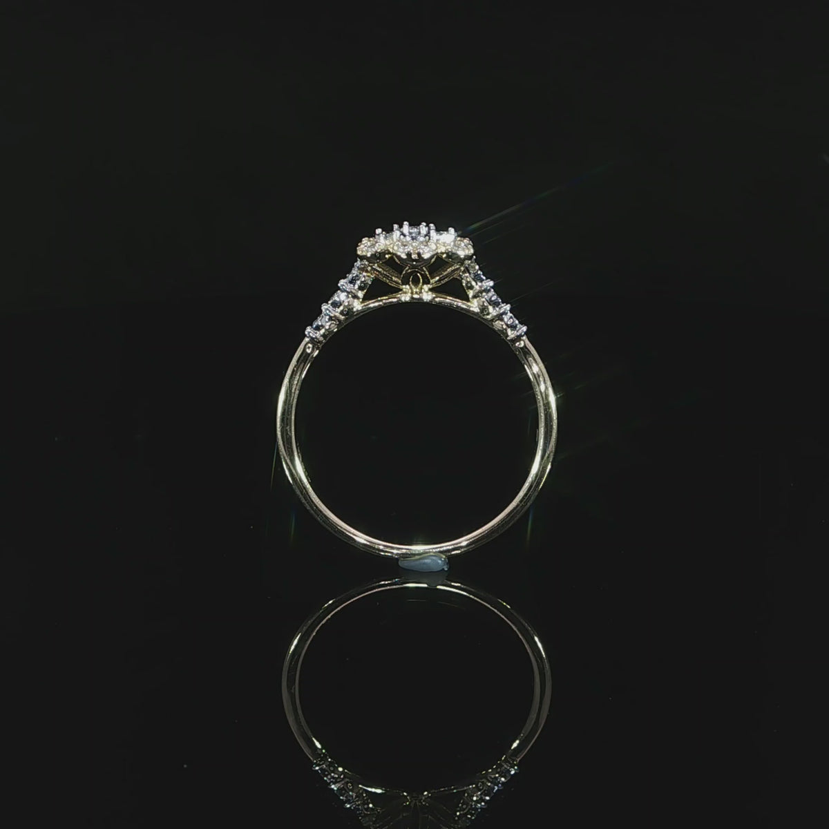 Gallery view of a 0.14 CTW diamond flower ring in 10K yellow gold with open supports beneath the floral setting.