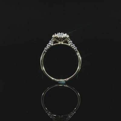 Gallery view of a 0.14 CTW diamond flower ring in 10K yellow gold with open supports beneath the floral setting.