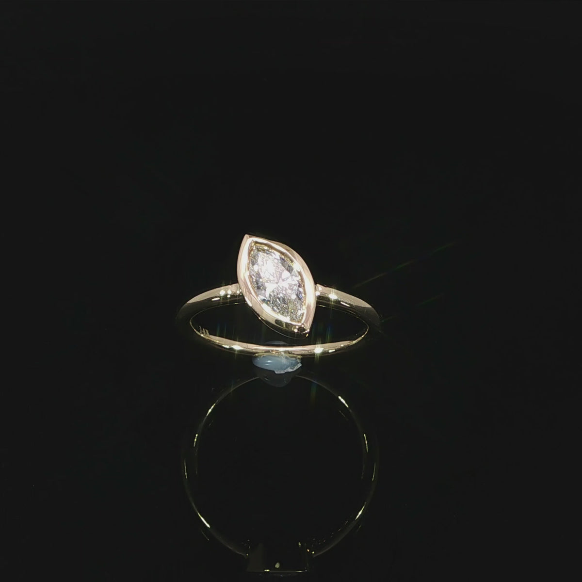 14K yellow gold engagement ring with an F-G color VS marquise lab grown diamond.
