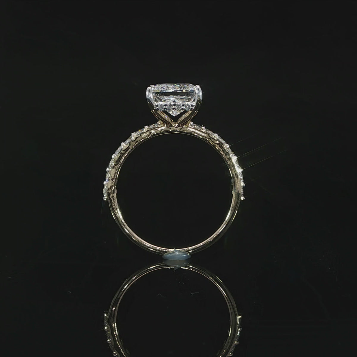 2 carat princess cut diamond solitaire engagement ring with a hidden halo and pavé accents.