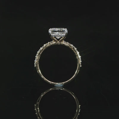 2 carat princess cut diamond solitaire engagement ring with a hidden halo and pavé accents.