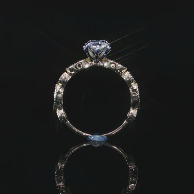 Detailed video of lab grown diamond engagement ring with bezel-set accent diamonds along the milgrain borders