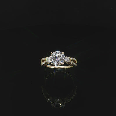 14K Gold round diamond ring with a split shank on a reflective black background