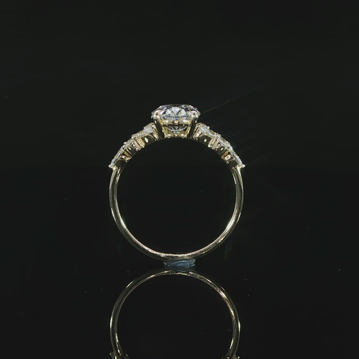14K yellow gold engagement ring with a 2 carat E color VS1 oval lab grown center diamond and side accents.
