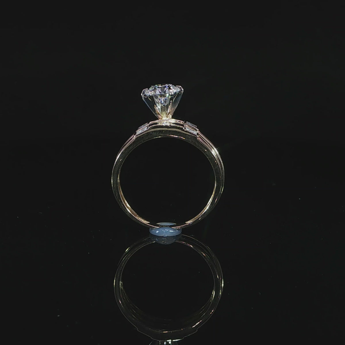 Profile of a 1.00 ct round lab-grown diamond in a raised prong setting with a matching yellow gold band.