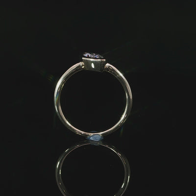 Modern marquise bezel engagement ring with a smooth polished 14K yellow gold shank.