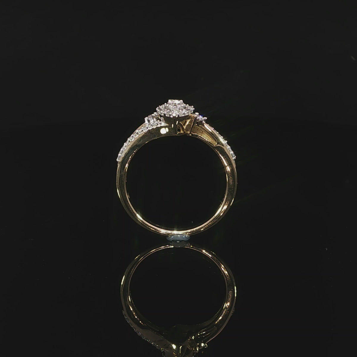 Upright video of a 10K yellow gold 0.29 CTW marquise-shaped illusion halo ring with shoulder diamonds.
