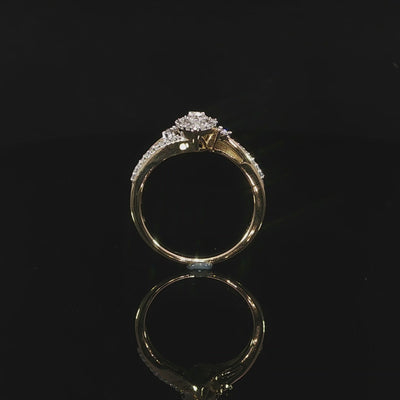 Upright video of a 10K yellow gold 0.29 CTW marquise-shaped illusion halo ring with shoulder diamonds.