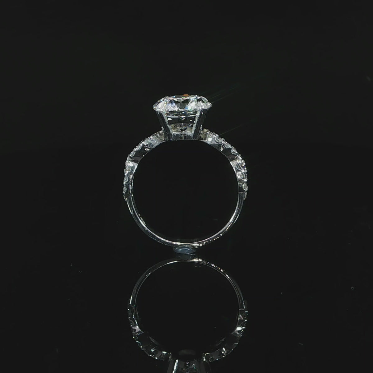 Standing view of a 14K white gold 3.37 CTW lab-grown diamond ring showing the twist shoulders and polished lower band.