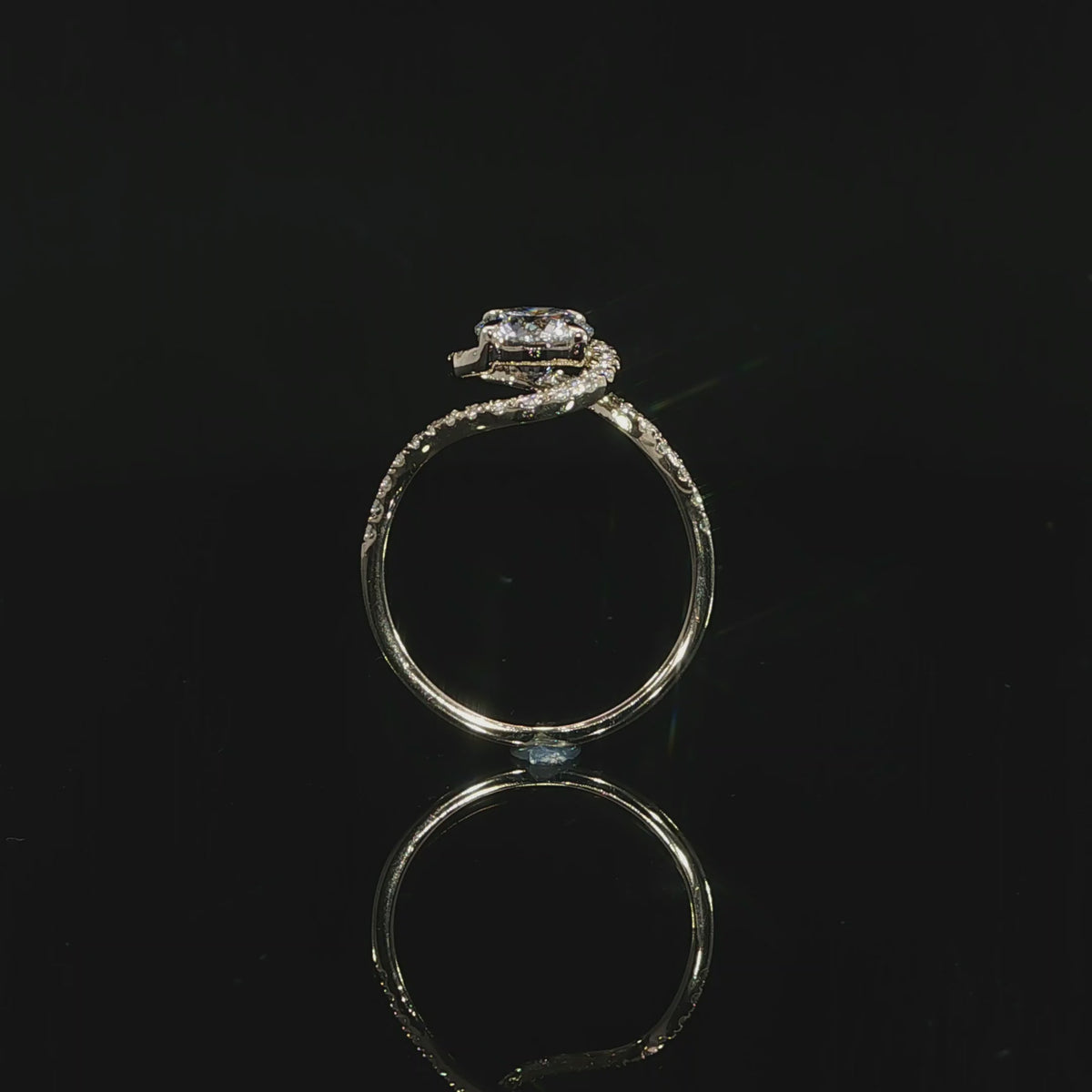 Sculptural flowing bypass engagement ring with round lab-grown diamond and pavé accents