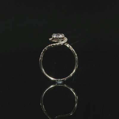 Sculptural flowing bypass engagement ring with round lab-grown diamond and pavé accents